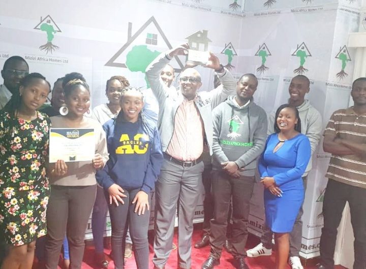 Mr.George Mburu,CEO,Mizizi Africa Homes with the company staff(photo;courtesy)