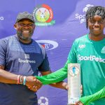 Gor-Mahia-defender-Paul-Ochuoga-left-recieves-his-SportPesa-League-Player-of-the-Month-Award-for-January-from-Japheth-Akulia-SportPesa-Partnerships-and-Sponsorships-Manager-