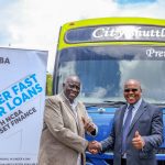 Chairman of City Shuttle SACCO - Michael Kariuki, and James Karinga, NCBA Group Head of Asset Finance during the handover of a new fleet of buses financed by the bank.