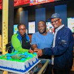 KCB Regional Business Manager, Moi Avenue Branch - Leah Choge, Joshua Ochieng (a parent) and Senior Business Development Manager, Personal Banking, Nelson Wanyonyi, cut a cake to commemorate the launch of KCB Under 18 Proposition at Garden City Mall, Nairobi.