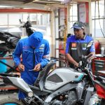 Charles Mulwa, Consultant for Yamaha East/Central Africa service's a customer's motorcycle during the 71st Anniversary Service Clinic, as part of the company's ongoing commitment to supporting the growing riding community in Kenya