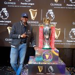KBL Marketing and Innovations Director, Mark Mugisha poses for a photo with the Premier League trophy